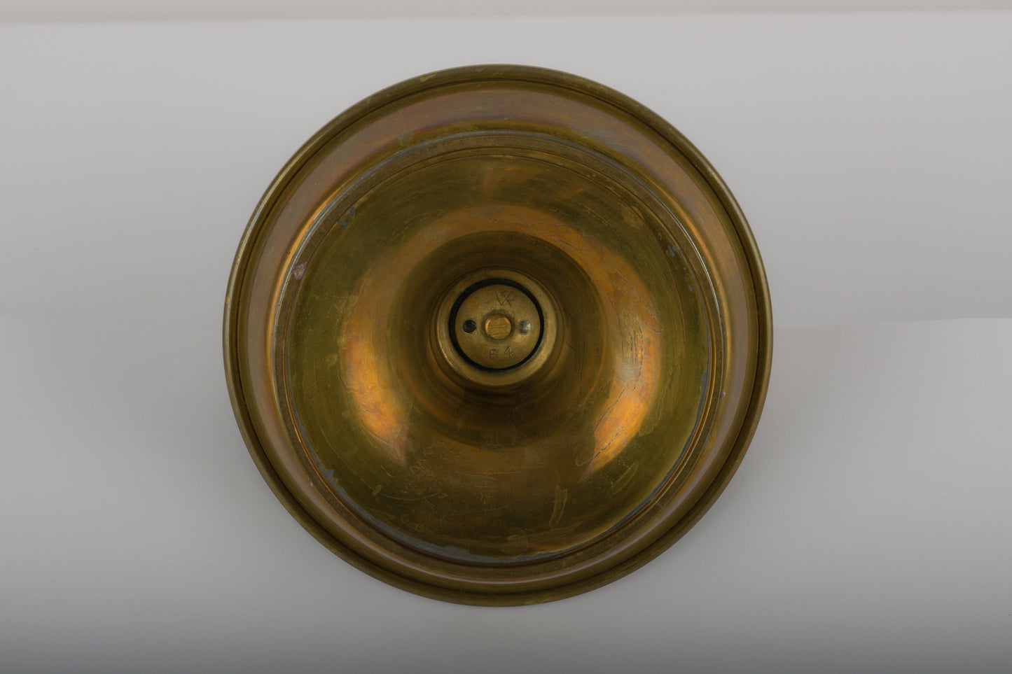 Bottom view of waxed brass candle holder by Tomi Parzinger with subtle design details from the 1990s USA warehouse
